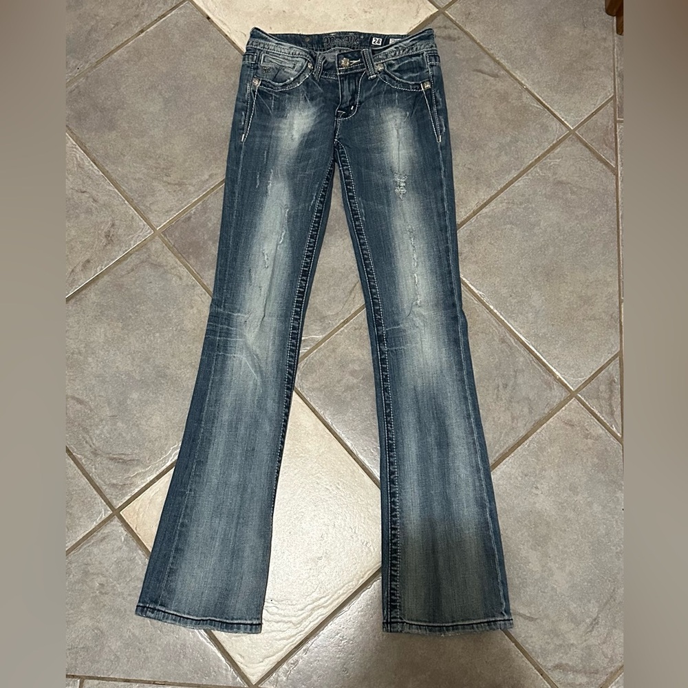 Woman’s Miss Me Jeans with peace sign pockets